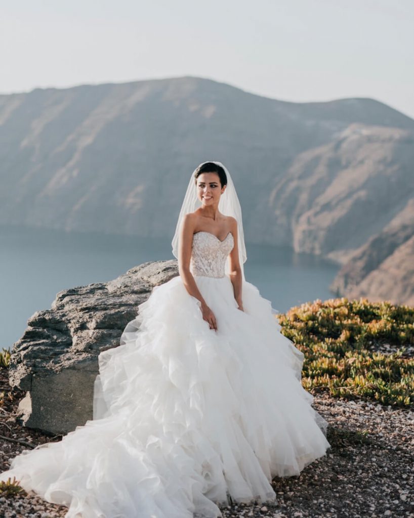 Santorini Weddings Chelsea wedding dress cliff